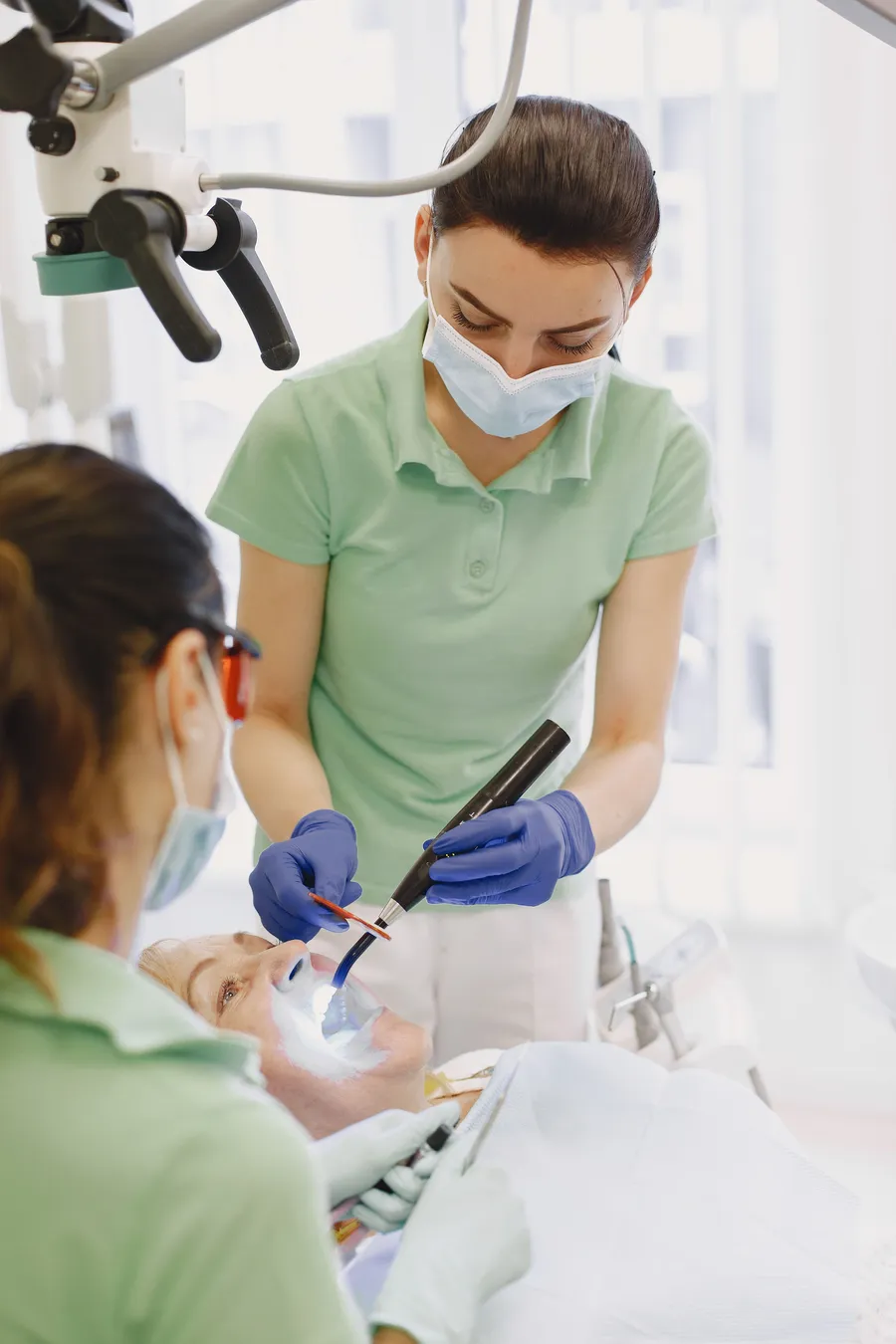 Hygienist explaining a cleaning to a patient